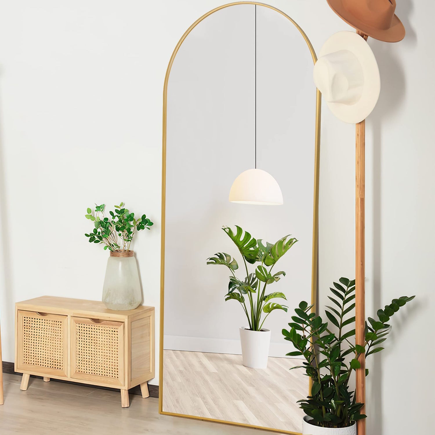 Arched floor mirror with elegant full-length design, placed in a contemporary interior setting-1