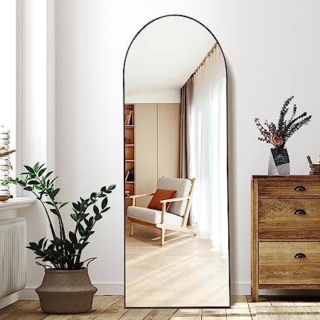 Arched floor mirror with elegant full-length design, placed in a contemporary interior setting-2