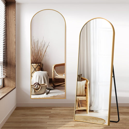 Arched floor mirror with elegant full-length design, placed in a contemporary interior setting