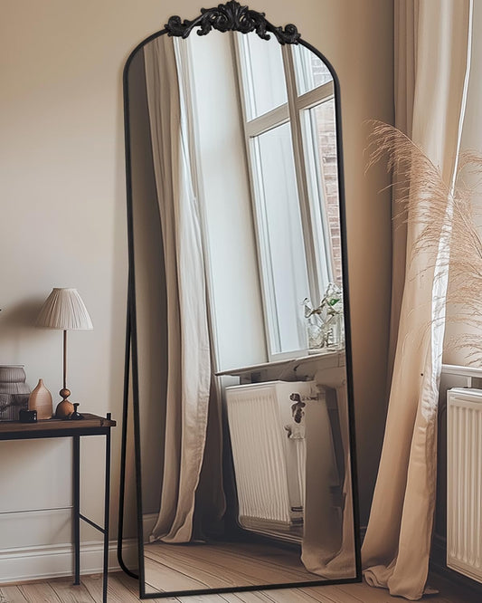 Arched freestanding full-length mirror with elegant frame, placed in a modern room setting-1