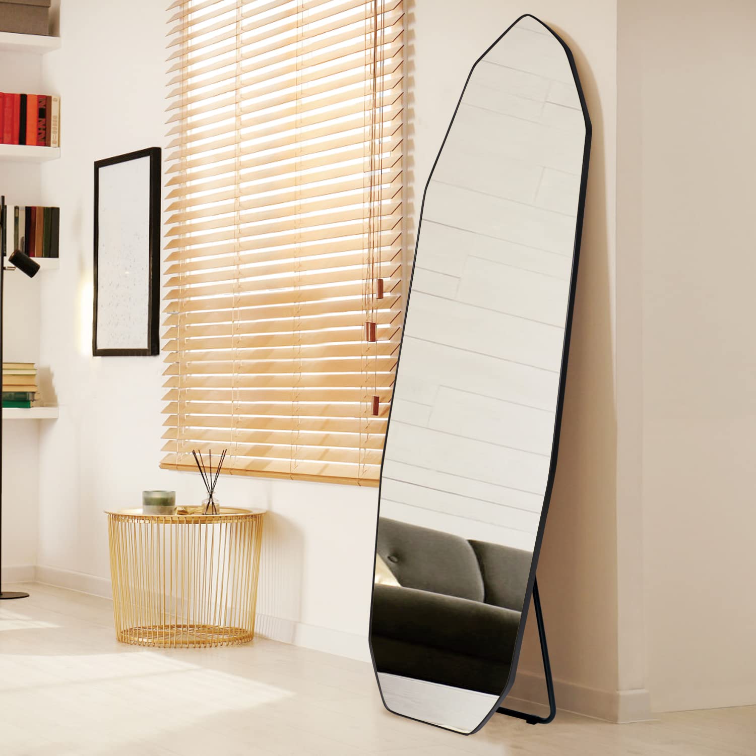 Irregular full-length mirror with sculptural frame, styled in a modern living space-1