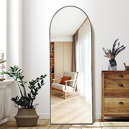 Arched floor mirror with elegant full-length design, placed in a contemporary interior setting-2