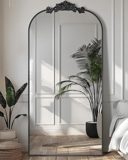Arched freestanding full-length mirror with elegant frame, placed in a modern room setting-3